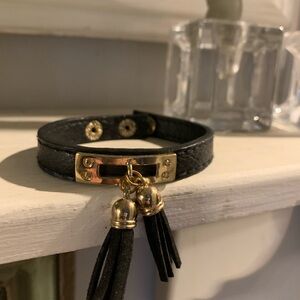 Elegant Black and Gold Bracelet with Tassels